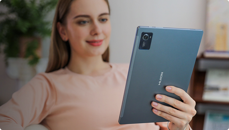 Huion Kamvas Slate 10 tablet with a hand holding the digital pen